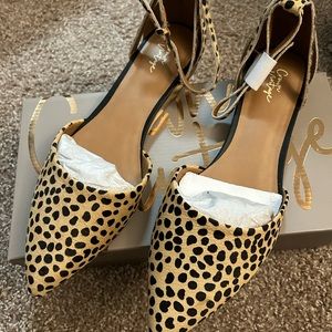 Brand new cheetah print shoes. Size 11. Stap is pony hair. Still in packaging.